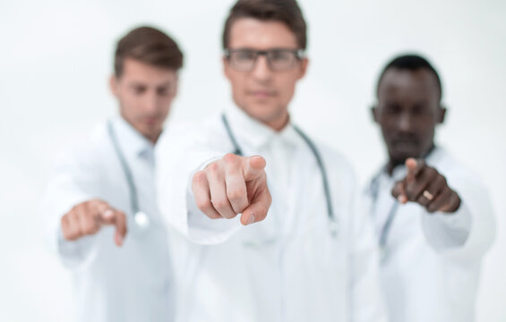 blurry image of a group of doctors pointing at you