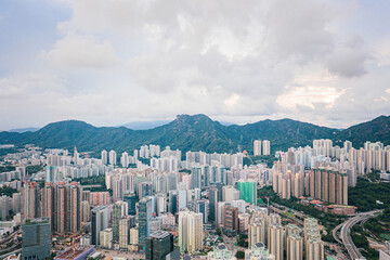 Fototapeta premium epic aerial view of cityscape in Kowloon district, Hong Kong, daytime
