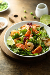 Healthy green salad with shrimps and avocado