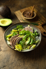 Healthy green salad with chicken and avocado
