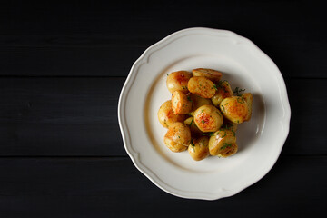 Fresh Cooked, new potatoes,with dill, on a wooden table, selective focus. close-up, toning, no people,
