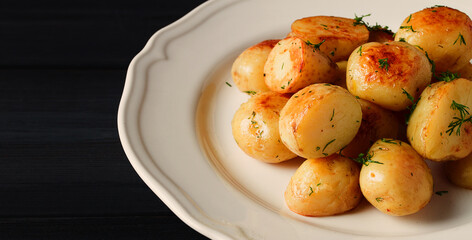 Fresh Cooked, new potatoes,with dill, on a wooden table, selective focus. close-up, toning, no people,
