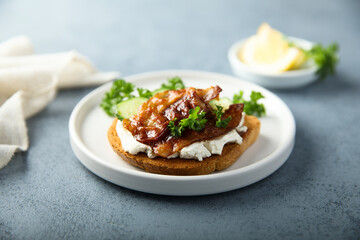 Homemade bacon sandwich with cream cheese and cucumber