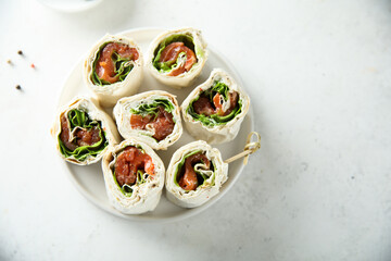 Homemade salmon wraps with fresh salad