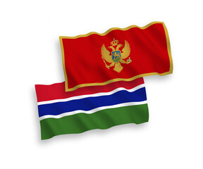 National vector fabric wave flags of Montenegro and Republic of Gambia isolated on white background. 1 to 2 proportion.