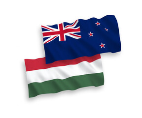 National vector fabric wave flags of New Zealand and Hungary isolated on white background. 1 to 2 proportion.