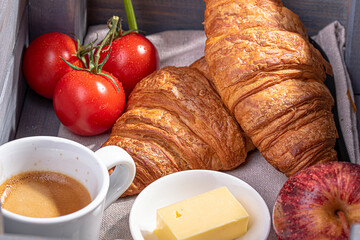 breakfast with croissant, espresso coffee in a box
