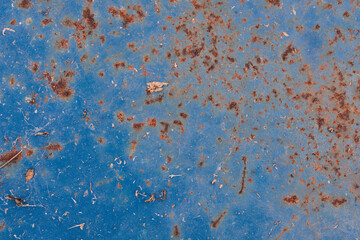 Metal texture covered with old blue paint with scratches and wear