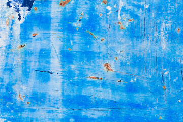 Metal texture covered with old blue paint with scratches and wear