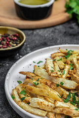 Oven roasted parsnips side dish on plate. Delicious vegetarian breakfast or snack, Clean eating, dieting, vegan food concept. vertical image. top view. place for text,