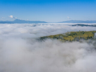 Morning fog in the Ukrainian Carpathians. Aerial drone view.