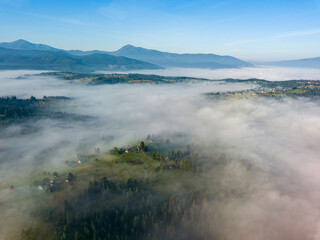 Morning fog in the Ukrainian Carpathians. Aerial drone view.
