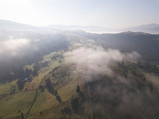 Obraz premium Morning fog in the Ukrainian Carpathians. Aerial drone view.