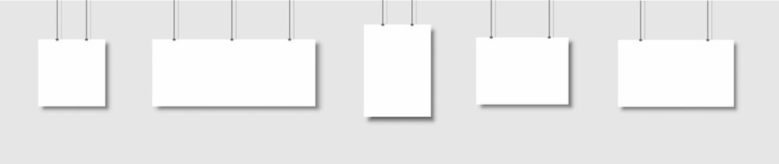 Template of white blank vector posters. Set of mockups hanging on the wall. Frame for paper sheet. Isolated on gray background. illustration