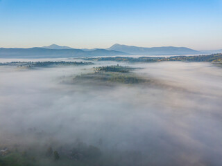 Morning fog in the Ukrainian Carpathians. Aerial drone view.