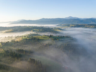 Morning fog in the Ukrainian Carpathians. Aerial drone view.