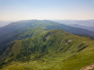 Fototapeta premium High mountains of the Ukrainian Carpathians in cloudy weather. Aerial drone view.