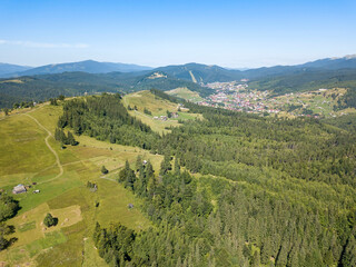 Fototapeta na wymiar Green mountains of Ukrainian Carpathians in summer. Sunny clear day. Aerial drone view.