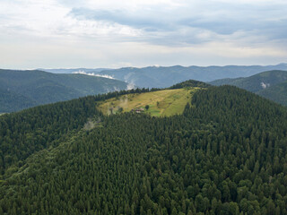 Obraz premium Green mountains of Ukrainian Carpathians in summer. Aerial drone view.