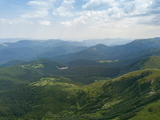 High mountains of the Ukrainian Carpathians in cloudy weather. Aerial drone view.