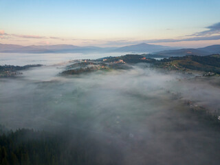 Morning fog in the Ukrainian Carpathians. Aerial drone view.