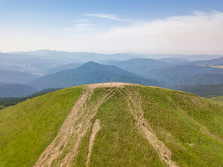 High mountains of the Ukrainian Carpathians in cloudy weather. Aerial drone view.