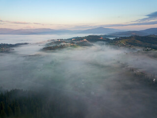 Morning fog in the Ukrainian Carpathians. Aerial drone view.