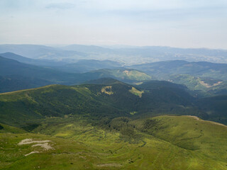 High mountains of the Ukrainian Carpathians in cloudy weather. Aerial drone view.