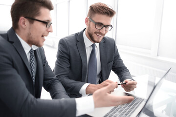 close up.two business people work on a laptop