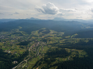 Obraz premium Green mountains of Ukrainian Carpathians in summer. Aerial drone view.