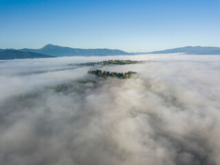 Morning fog in the Ukrainian Carpathians. Aerial drone view.