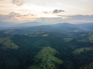 Sunset over the mountains in the Ukrainian Carpathians. Evening. Aerial drone view.