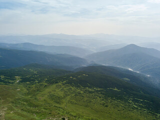Naklejka premium High mountains of the Ukrainian Carpathians in cloudy weather. Aerial drone view.