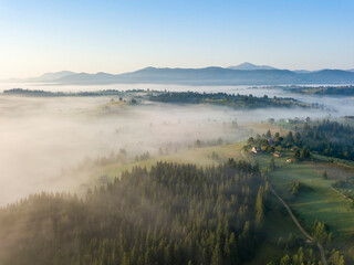 Morning fog in the Ukrainian Carpathians. Aerial drone view.