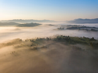 Morning fog in the Ukrainian Carpathians. Aerial drone view.