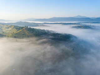 Morning fog in the Ukrainian Carpathians. Aerial drone view.