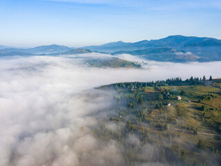 Morning fog in the Ukrainian Carpathians. Aerial drone view.