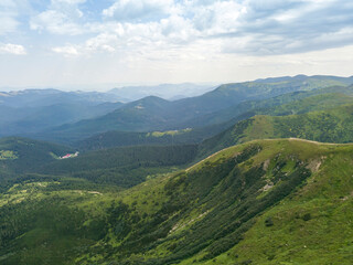 Naklejka premium High mountains of the Ukrainian Carpathians in cloudy weather. Aerial drone view.
