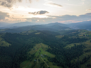 Sunset over the mountains in the Ukrainian Carpathians. Evening. Aerial drone view.