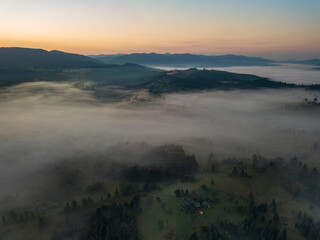 Morning fog in the Ukrainian Carpathians. Aerial drone view.
