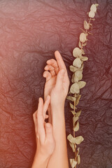 Beauty hands woman with flowers on background. Skin care cosmetics