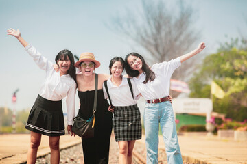 group of asian woman happiness face standing outdoor