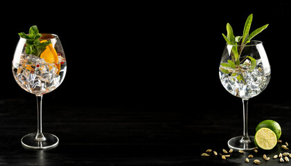 Modern Cocktail gin tonic herb spices fishbowl glass plain background - obrazy, fototapety, plakaty