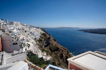 Panoramic view of the famous village Fira, the volcano Nea Kameni and the Aegean Sea in Santorini