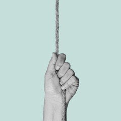 man in black and white pulls a rope