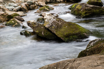 Fototapeta na wymiar Fast flowing water/waterfalls flowing through the Aberglaslyn Pass near to Beddgelert, in Snowdonia National Park, north Wales