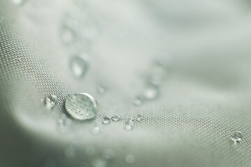 waterproof fabric with waterdrops. non woven fabric water texture background Water drops on...
