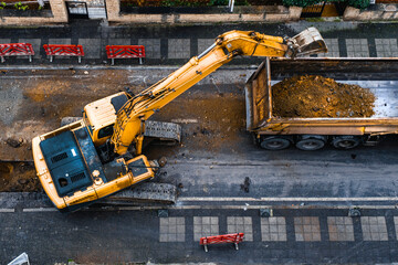 construction equipment excavates a city street to improve the wastewater infrastructure. Top View....