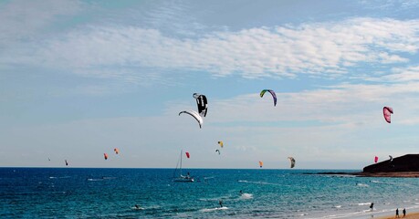 parasailing, coastline on a sunny day, background