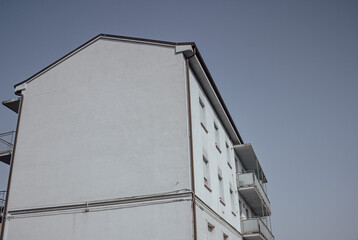 White building against the blue sky. Renovation concept. Superbonus 110 in Italy.
